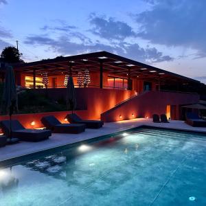 a swimming pool in front of a house at Mirazur in Meganisi