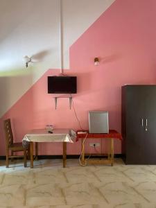 TV a/nebo společenská místnost v ubytování Island Breeze Inn + 31 fotografií