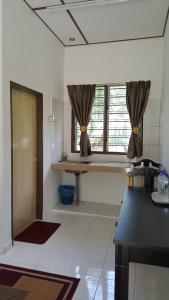 Kuchyň nebo kuchyňský kout v ubytování D'Impiana Riverview Chalet # Lenggong