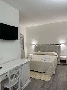 Postel nebo postele na pokoji v ubytování Sa Jacca Albergo Rurale
