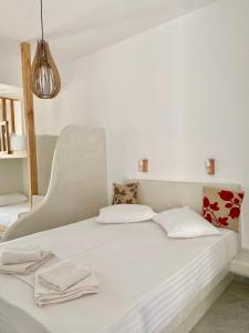 Postel nebo postele na pokoji v ubytování Fikas Hotel