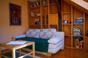 a living room with a couch and a table at Apartmán NIKA in Levoča