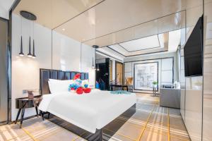 TV a/nebo společenská místnost v ubytování Minimax Hotel Shanghai Songjiang + 24 fotografií