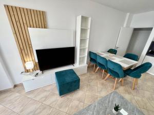 TV a/nebo společenská místnost v ubytování Bianca Beach Apartment