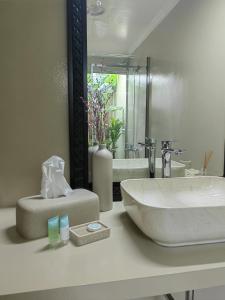 a bathroom counter with a sink and a mirror at Villa 29 Suite A - Home Vacation in Dubai