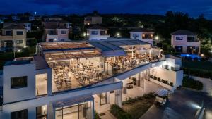 an aerial view of a building at night at Hotel St.John Suites Adults Only in Tsilivi