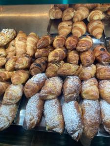 a bunch of pastries on display in a bakery at WHITEHOUSE in Lecce