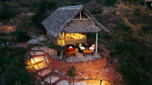 an aerial view of a house with a roof at Soroi Cheetah Tented Camp in Mwatate
