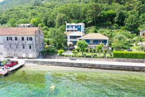 an aerial view of a house and a river at Apartments Ivanović in Kotor