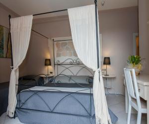 Postel nebo postele na pokoji v ubytování Hotel Monti