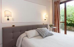 Postel nebo postele na pokoji v ubytování Hotel Monti