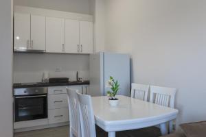 A kitchen or kitchenette at Trea Apartment Még 12 kép