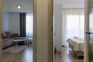 เตียงในห้องที่ Trea Apartment