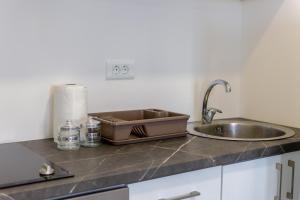 ครัวหรือมุมครัวของ Trea Apartment