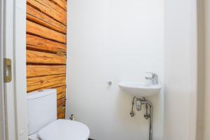 a bathroom with a toilet and a sink at Ringi Apartments in Pärnu