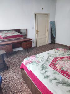 Un ou plusieurs lits dans un hébergement de l'établissement Noor Apartment