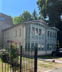 a house with a blue and white house at Pearl of Sopot in Sopot