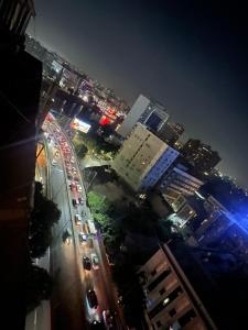 a view of a city at night with traffic at Unique apartment 