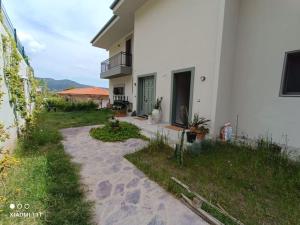 a house with a walkway in front of it at Suna Summer House in Marmaris