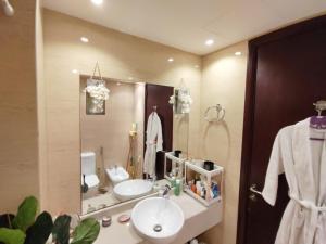 a bathroom with a sink and a mirror at House 369 in Ras al Khaimah