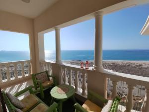 a balcony with a view of the ocean at House 369 in Ras al Khaimah