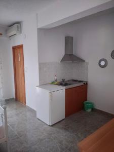 a kitchen with a sink and a counter top at Vigla House in Sykia Chalkidikis