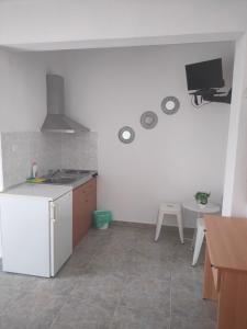 a kitchen with a sink and a stove top oven at Vigla House in Sykia Chalkidikis