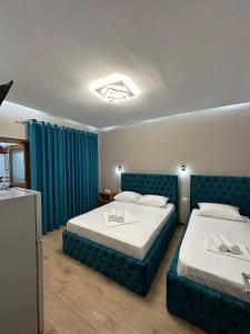 Postel nebo postele na pokoji v ubytování Guesthouse Dauti