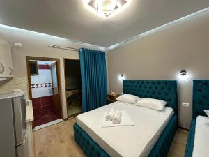 Postel nebo postele na pokoji v ubytování Guesthouse Dauti