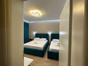 Postel nebo postele na pokoji v ubytování Guesthouse Dauti