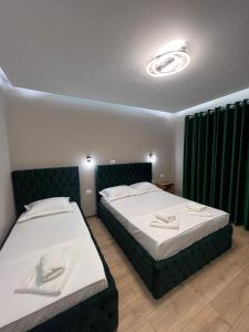 Postel nebo postele na pokoji v ubytování Guesthouse Dauti
