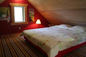 a bedroom with a large bed in a attic at Türju rannamaja 