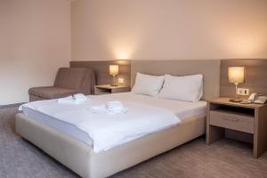 Postel nebo postele na pokoji v ubytování Garni Hotel MB