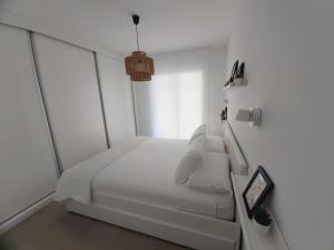 Łóżko lub łóżka w pokoju w obiekcie MAR & SAL Roquetas de Mar playa de las Salinas