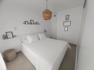 Łóżko lub łóżka w pokoju w obiekcie MAR & SAL Roquetas de Mar playa de las Salinas