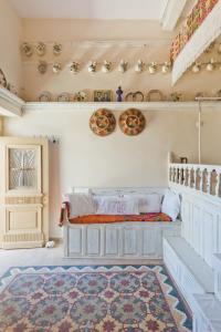 a bedroom with a bed and a rug at Traditional Karpathian house in Karpathos Town