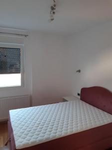 Postel nebo postele na pokoji v ubytování Glušac Lux