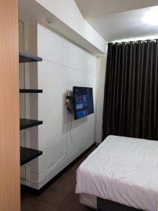 En eller flere senge i et værelse på RoomQu at Apartment Tree Park + 17 billeder