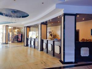 a store aisle with a bunch of clothes on display at Moonlight Hotel - All Inclusive in Sveti Vlas