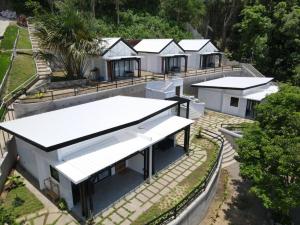 an overhead view of a house with white roofs at Oceanarra Beach Hotel and Resort Inc. in San Luis