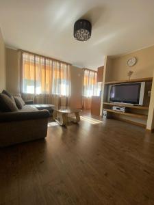 Телевизор и/или развлекательный центр в Central Apartment