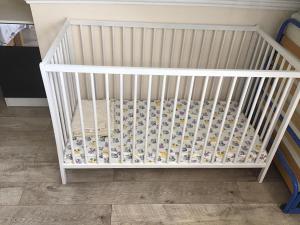 A bed or beds in a room at Family Wellness Apartman