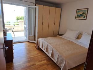 Postel nebo postele na pokoji v ubytování Apartments Granić