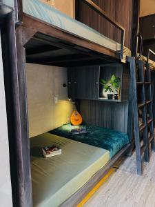 a room with two bunk beds in a room at T Zone Hostel in Ho Chi Minh City