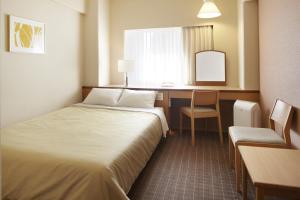 Кровать или кровати в номере Hotel New Hankyu Osaka