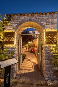an entrance to a stone building with an open door at Artelier Vama Veche in Vama Veche