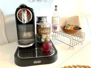 a coffee maker with an apple on a table at Behagliches Apartment für 2 in Wetzlar +3 photos
