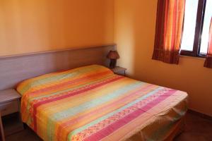 A bed or beds in a room at Green Park Residence