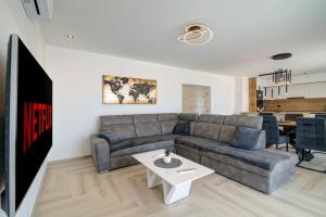 a living room with a couch and a table at FRANKO in Senj