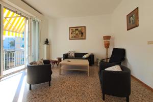 Et opholdsområde på Pesaro grand appartement de 1 à 6 personnes parking privé, zone mer